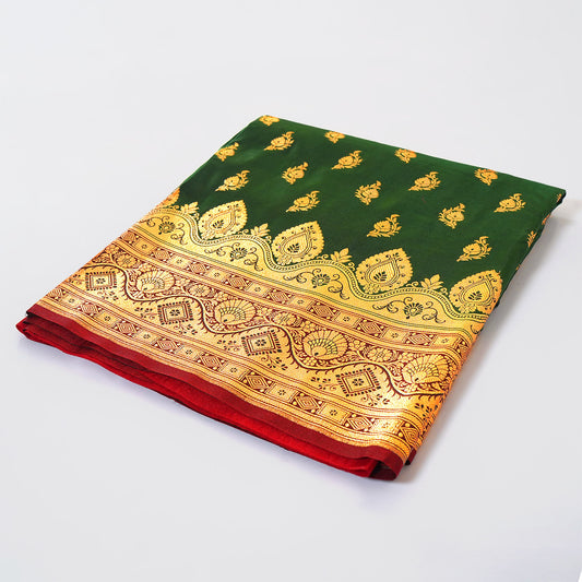 Elevate your style with our Green Banarasi Silk Saree. Zari border adds timeless charm. Embrace tradition in understated elegance. Shop now!