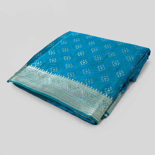 Sky Blue Banarasi Saree, Zari Border Silk Saree, Traditional Indian Attire, Banarasi Craftsmanship, Ethnic Wedding Saree, Elegant Silk Drapes, Festive Occasion Wear, Bloomaya Saree Collection, Luxury Indian Fashion, Versatile Ethnic Wear.